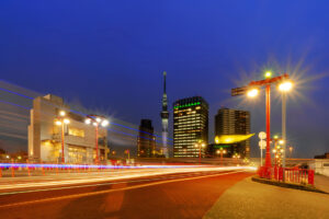 Downtown Tokyo with night lights. Financial district and business centers in smart urban city in Asia. Skyscraper and high-rise buildings. Japan